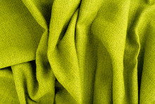Wave Green Natural Linen Fabric Textile Material Texture As A Background. Green Textile Pattern For Design In Fashion As Abstract Background. Abstract Green Natural Fabric Background.