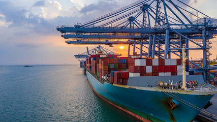 Wall Mural - Aerial view container ship carrying container in import export business logistic and transportation of international by container ship in the open sea.
