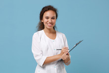 Smiling African American Female Doctor Woman In White Medical Gown Hold Clipboard With Medical Documents Isolated On Blue Background. Healthcare Personnel Medicine Health Concept. Mock Up Copy Space.