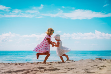 cute little girls dance at beach, family enjoy tropical vacation