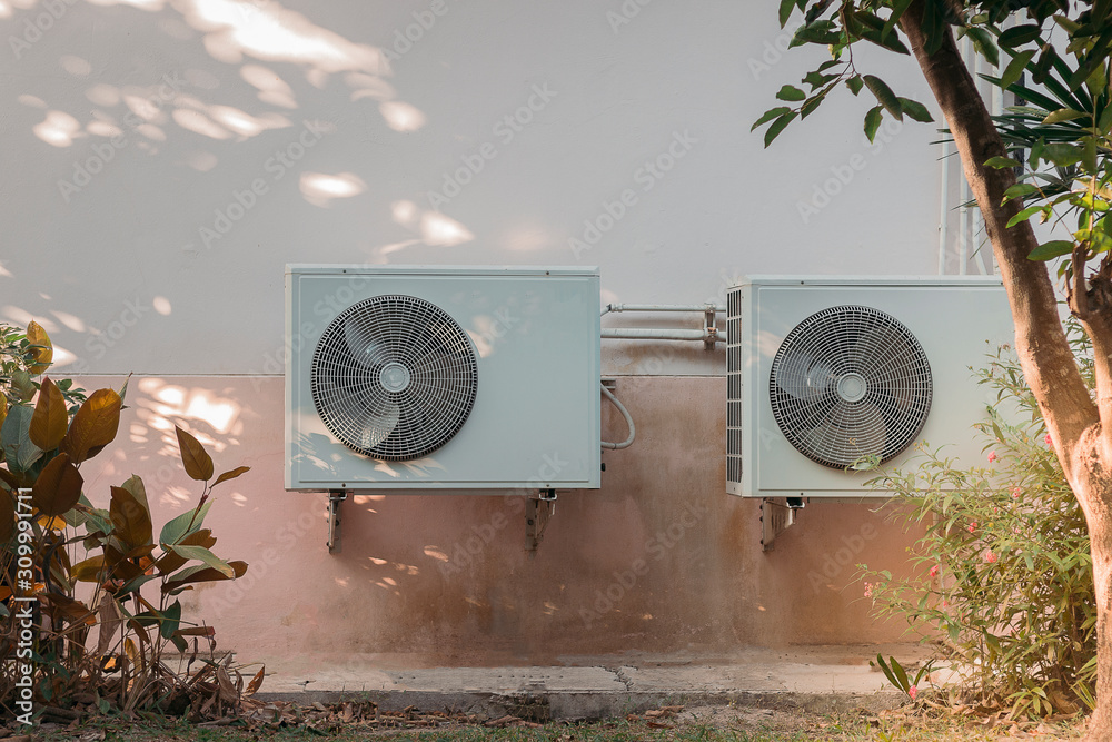 air conditioner compressor outdoor unit installed outside the house ...