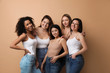 © New Africa - Group of women with different body types on beige background