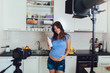 © Mediteraneo - Pregnant woman recording video for blog and vlog