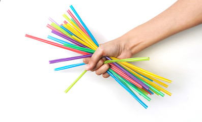 Plastic straw in the hand on a white background, stop the plastic straw and secure environment concept