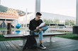 © GalakticDreamer - Student working with papers and sitting on bench