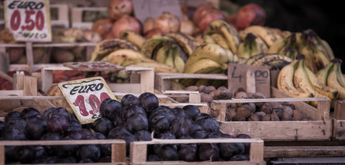 Wall Mural - fresh plums at a market