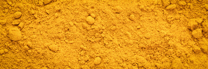 turmeric root powder background and texture