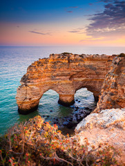 Wall Mural - Heart-shaped cliffs on the shore of Atlantic ocean in Algarve, Portugal. Beautiful summer landscape.