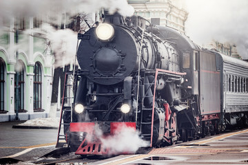 Wall Mural - Steam train departs from the railway station. Moscow.