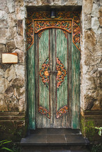 Traditional Balinese Handmade Carved Wooden Door. Bali Style Furniture With Ornament Details. Old And Vintage Local Style Of Architecture In Bali. Handmade Details.