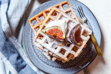 Plate Of Thick Belgian?waffles With Whipped Cream, Powdered Sugar And Figs