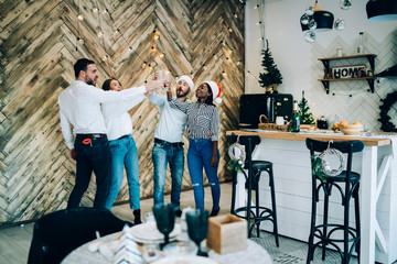 Wall Mural - Friends cheering on Christmas party