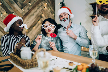 Wall Mural - Multiracial friends on Christmas party