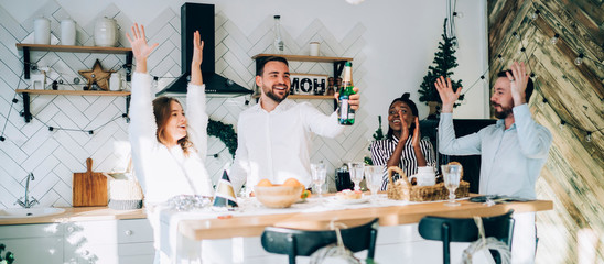 Wall Mural - Group of friends with bottle of champagne