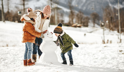 Poster - happy family mother and children having fun on winter walk