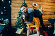 Young smiling woman piggybacking bearded male