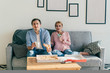 © GalakticDreamer - Tense couple eating pizza on couch