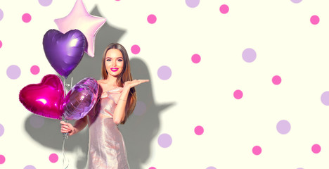 Wall Mural - Valentine Beauty girl with pink heart shaped air balloons portrait pointing hand, isolated on polka dots background. Beautiful Happy Young woman presenting products. Holiday party, birthday. 