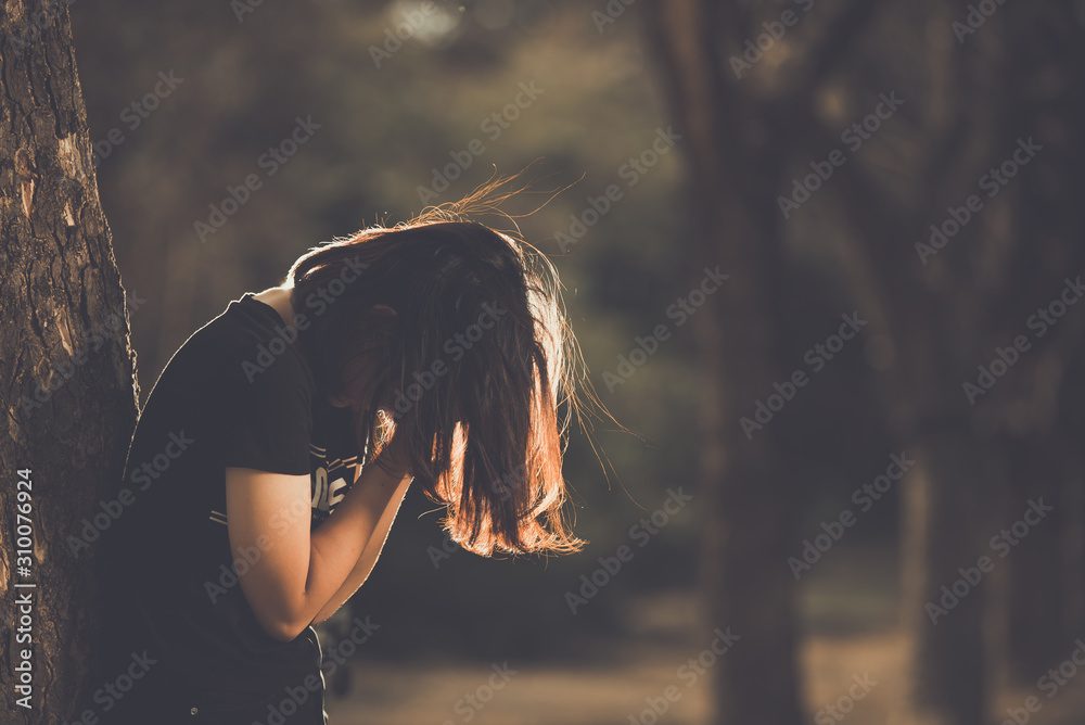 Asian beautiful girl feel alone in the forest,Sad woman concept,Thailand people,Lady sadness about love from boyfriend,She feeling broken heart - obrazy, fototapety, plakaty 
