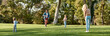© Svitlana - Have a cool weekend. Parents playing frisbee with their kids in the park on a sunny day