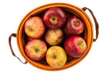 Wall Mural - Apples basket disposed on a white background. Top view of autumn concept. Cut out.