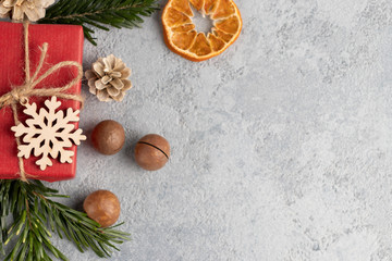 christmas or new year gray background with decorations from natural materials - christmas tree twigs