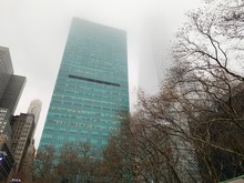 New York, NY - December 14, 2019 - Views On A Foggy Day From Bryant Park Overlooking A Loony 1095 Avenue Of Americas Aka 6th Avenue During The Christmas Season