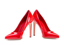 Red Shoes Isolate On A White Background. A Pair Of Elegant Women's Shoes. Beautiful Red High-heeled Shoes. Classic Women Shoes With Heels.