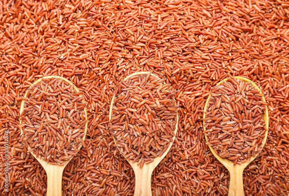 Spoons with raw rice, top view