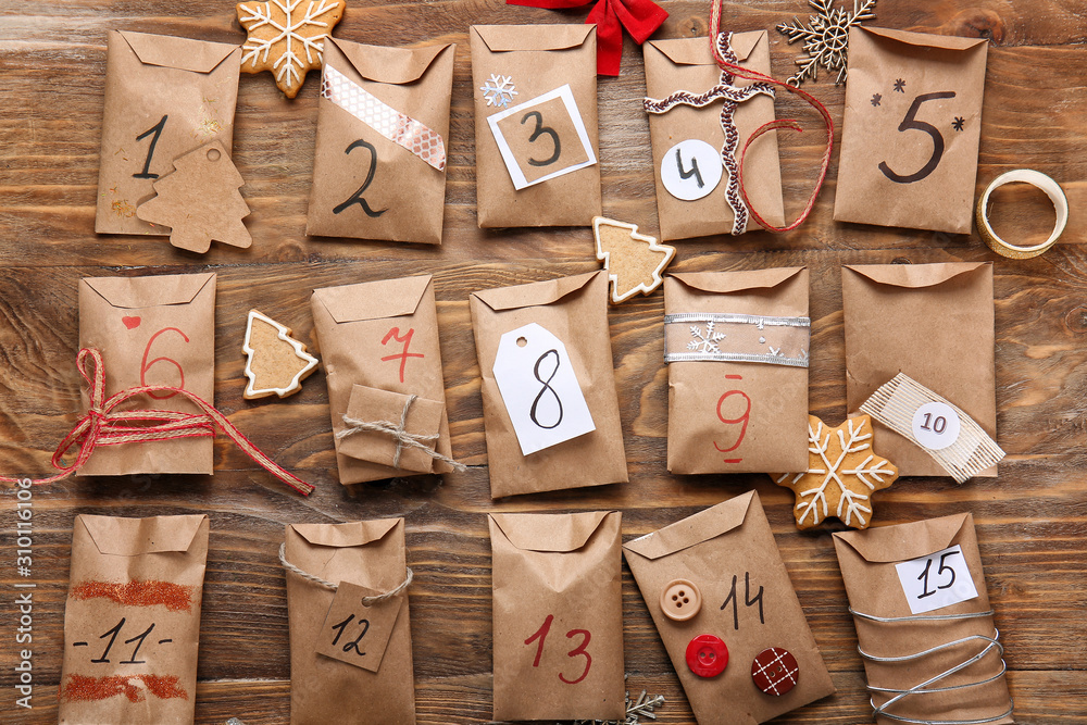 Creative Christmas calendar on wooden background