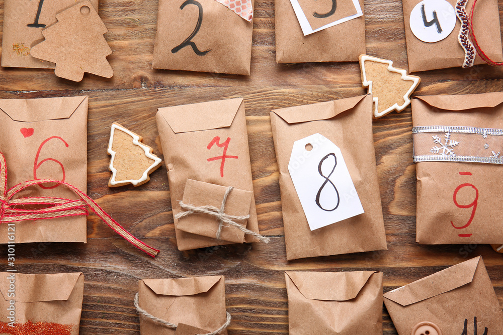 Creative Christmas calendar on wooden background