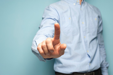 Unidentified man clicks his fingers on an invisible screen