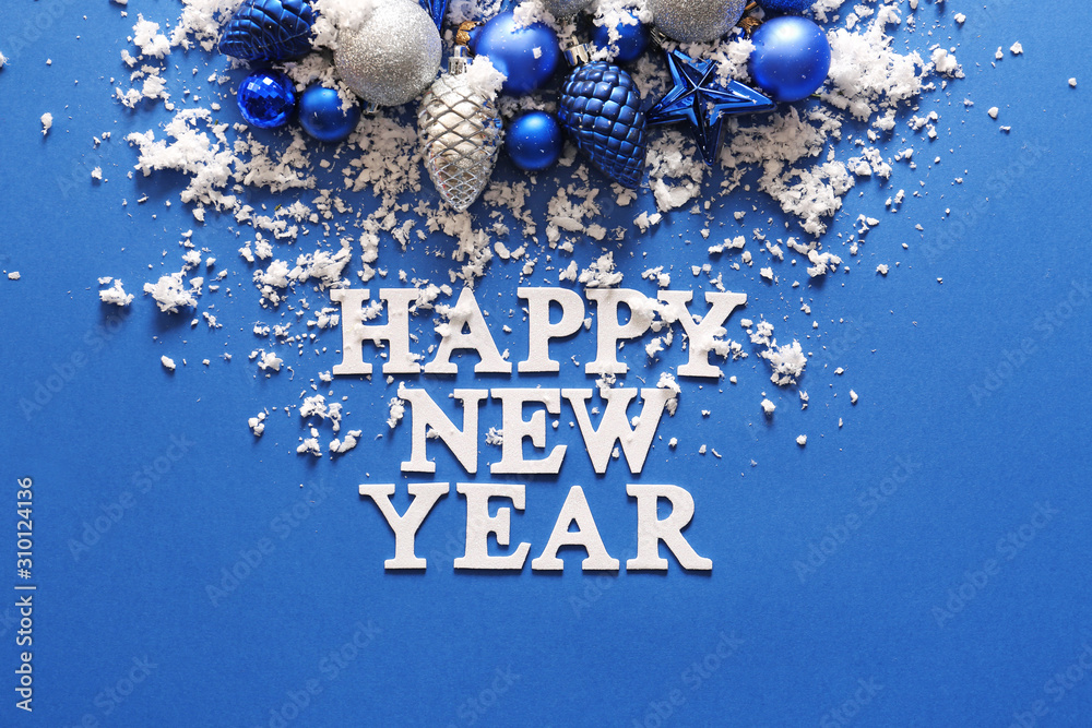 Text HAPPY NEW YEAR with decor and snow on color background