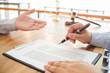 © Charlie's - Legal counsel presents to the client a signed contract with gavel and legal law. justice and lawyer concept .