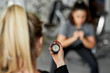 © gpointstudio - Close up of fitness instructor checking the time