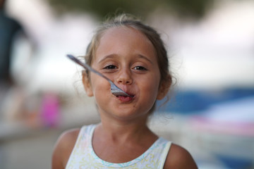 portrait of a 4 year old girl making funny faces