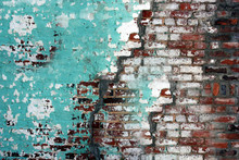 The Cracked Wall Of The Old House Is Smeared With Green And White Paint