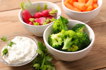 Sticker - broccoli, radish, carrot and dipping sauce