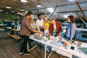 Poster - Creative team discussing new product plan, choosing main color