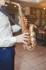 Saxophone, music instrument played by saxophonist player musician