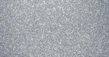 Wall Mural - Silver glitter background with sparkling texture. Silver shimmering light, stars sequins sparks and glittering glow foil background
