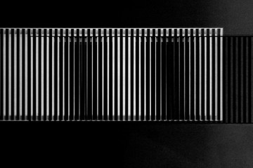 Poster - Lath structures as pattern with irregular or gently chaotic stripes resembling bar code or business architecture fragment. Abstract geometric template against black background.