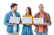 © LIGHTFIELD STUDIOS - positive young friends holding laptops isolated on white