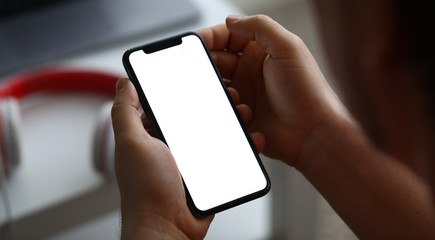 Male hand hold modern smartphone with blank scereen