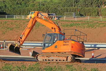 Wall Mural - Digger on a road construction site