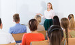© JackF - Young female teacher lecturing to students