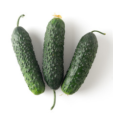 Wall Mural - Three fresh cucumbers on white background, image