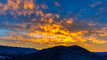 Wall Mural - silhouetted Hill at Sunset Sunrise