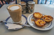 Portuguese typical sweet custard tart with coffee 