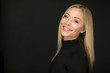 © Crystal Madsen - Beautiful portrait of smiling blond woman on a black background